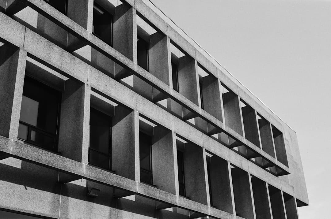 Modular architectural facade with repeating bays, the structural analogue of the five-stage AI content pipeline