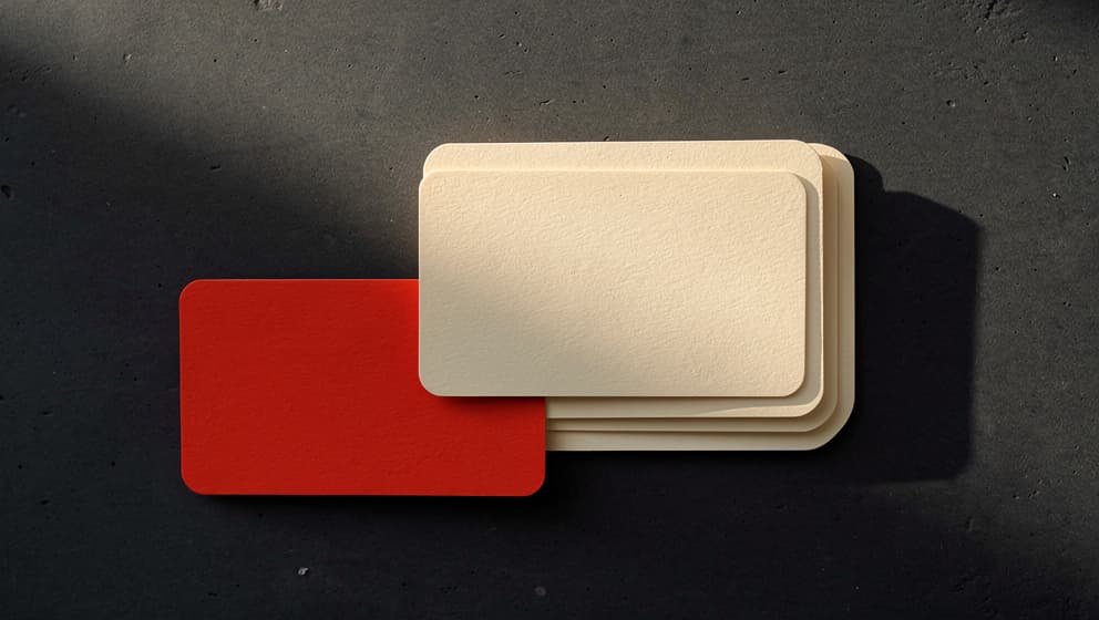 Stacked paper cards with one offset in red representing the curation discipline behind a Claude Code skills stack