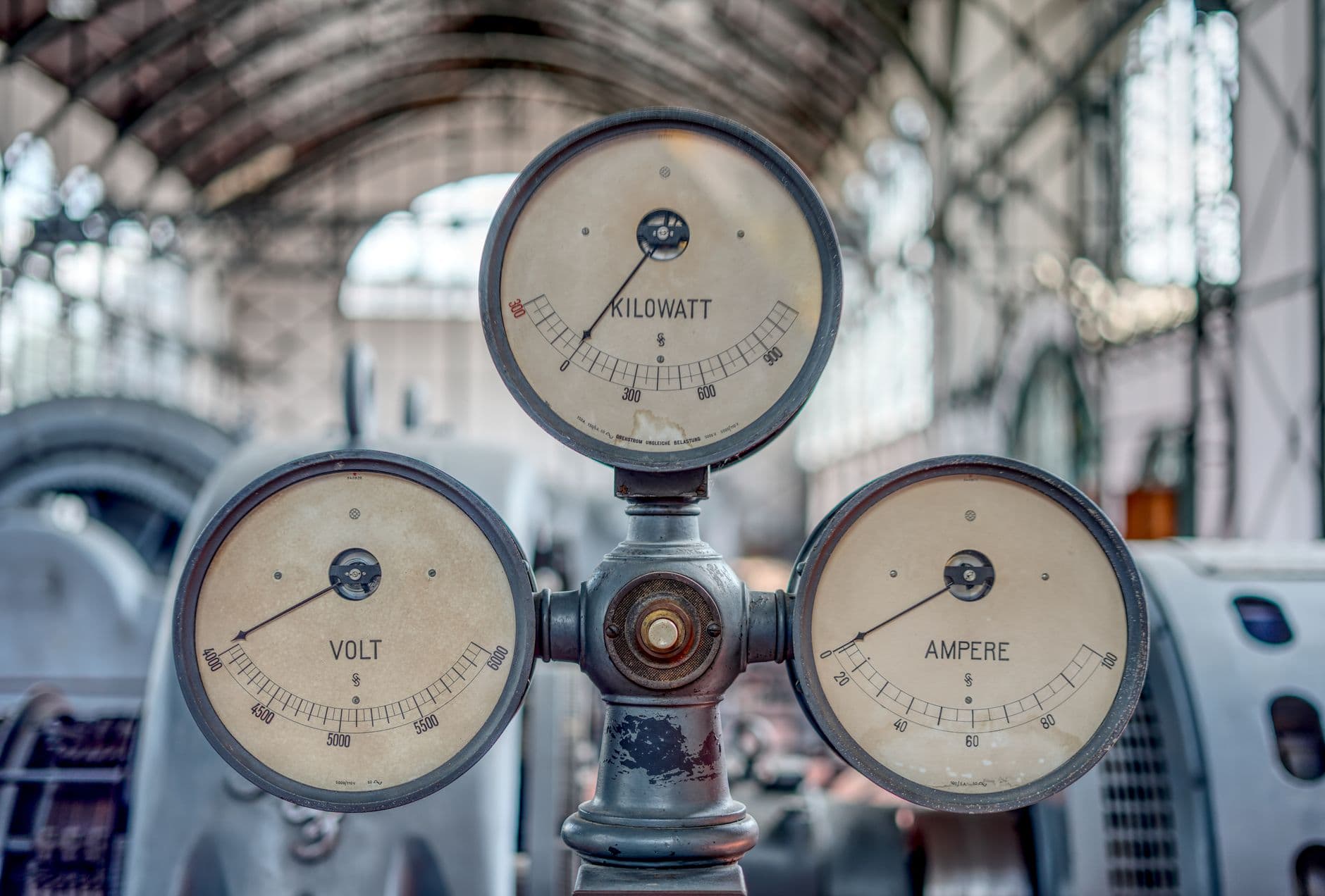 Row of industrial volt, ampere and kilowatt gauges, the instrumentation most enterprise AI agents ship without